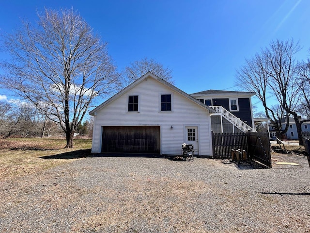 6 Naskeag Rd, Brooklin, ME 04616 - exterior space with stairs, a garage, and gravel driveway