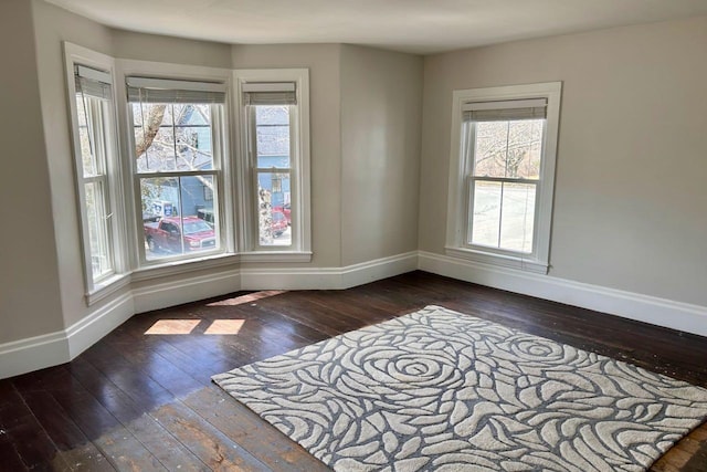 6 Naskeag Rd, Brooklin, ME 04616 - empty room with baseboards, a wealth of natural light, and dark wood-type flooring