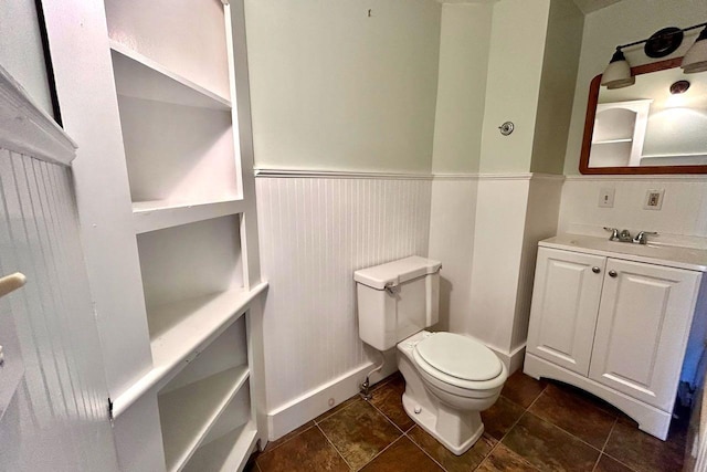 6 Naskeag Rd, Brooklin, ME 04616 - bathroom featuring vanity, toilet, and a wainscoted wall