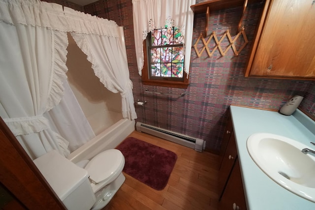 bathroom featuring shower / bathtub combination with curtain, wood finished floors, toilet, vanity, and baseboard heating