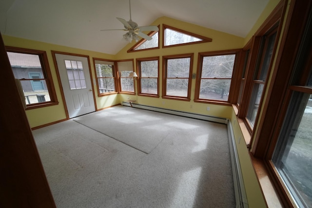 unfurnished sunroom with a baseboard heating unit and a wealth of natural light