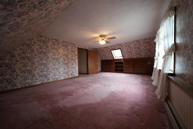additional living space with ceiling fan, carpet flooring, and wallpapered walls
