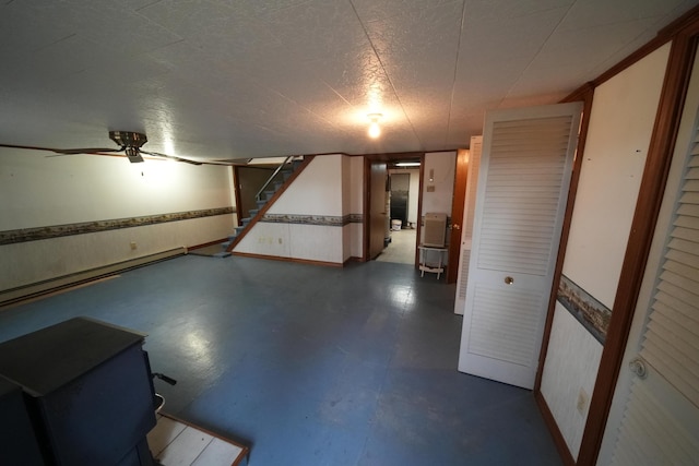 finished basement with baseboard heating and stairway