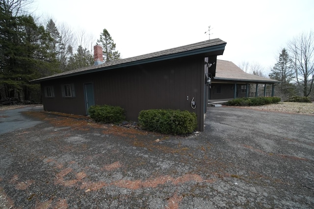 view of side of property featuring a chimney