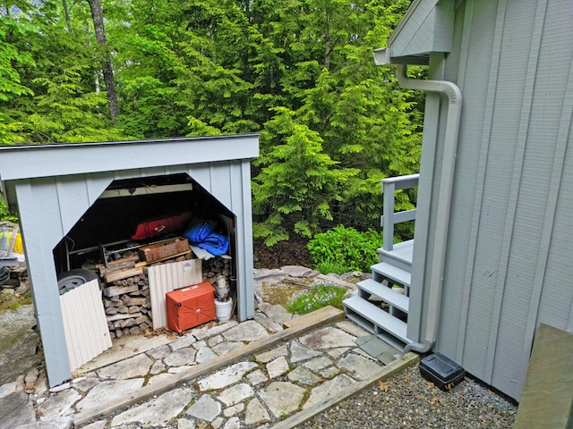 view of patio with a storage unit and an outbuilding