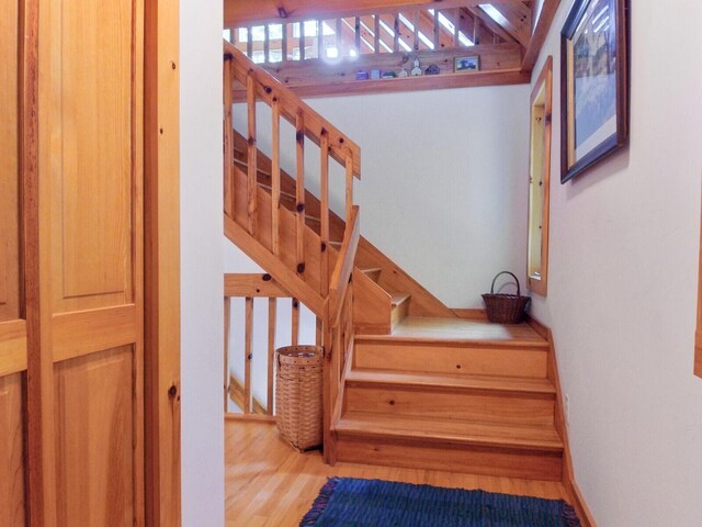 stairs with wood finished floors