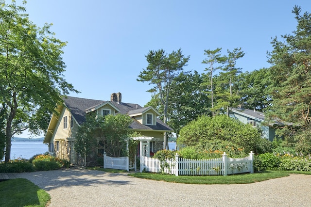 22 Porter Rd, Belfast, ME 04915 - new england style home with a chimney, a water view, and a fenced front yard