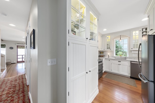 22 Porter Rd, Belfast, ME 04915 - hall featuring light wood-style flooring, a sink, and recessed lighting