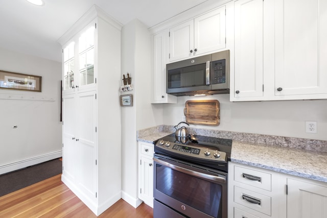 22 Porter Rd, Belfast, ME 04915 - kitchen featuring stainless steel appliances, light wood-style flooring, white cabinetry, and a baseboard radiator