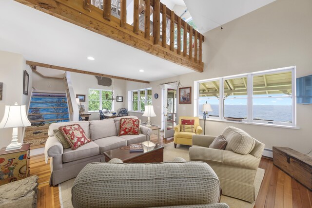 22 Porter Rd, Belfast, ME 04915 - living area with recessed lighting, wood finished floors, a baseboard radiator, and stairs