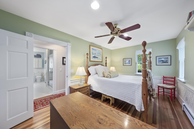 22 Porter Rd, Belfast, ME 04915 - bedroom with a ceiling fan, wood finished floors, connected bathroom, and a baseboard radiator