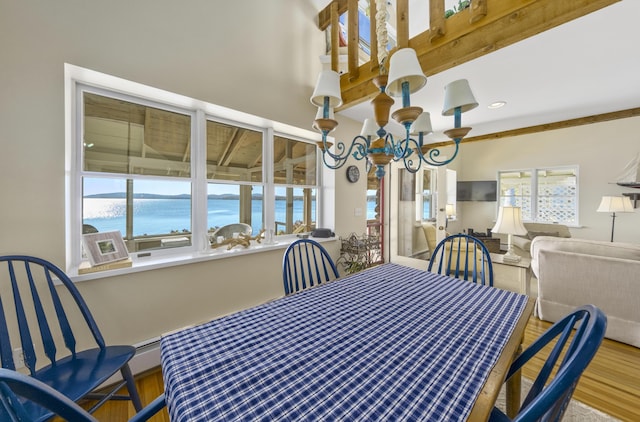 22 Porter Rd, Belfast, ME 04915 - dining room featuring an inviting chandelier, wood finished floors, and plenty of natural light