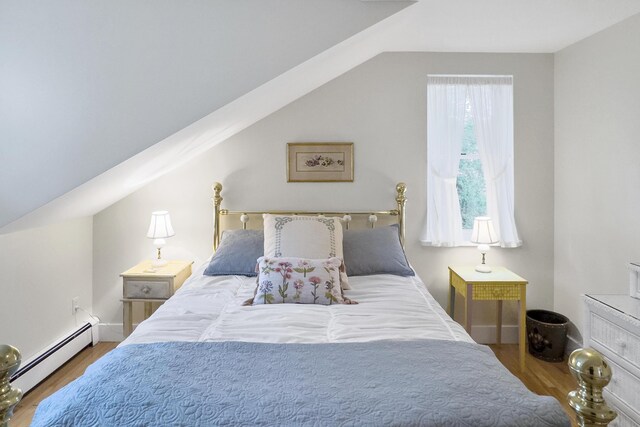 22 Porter Rd, Belfast, ME 04915 - bedroom featuring vaulted ceiling, wood finished floors, and baseboard heating