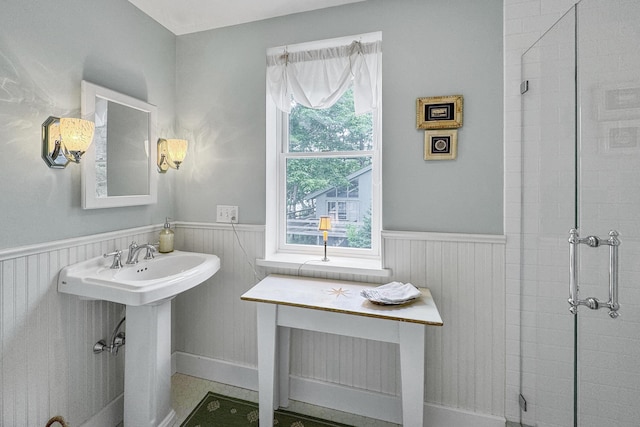 22 Porter Rd, Belfast, ME 04915 - bathroom featuring wainscoting, a tile shower, and a sink