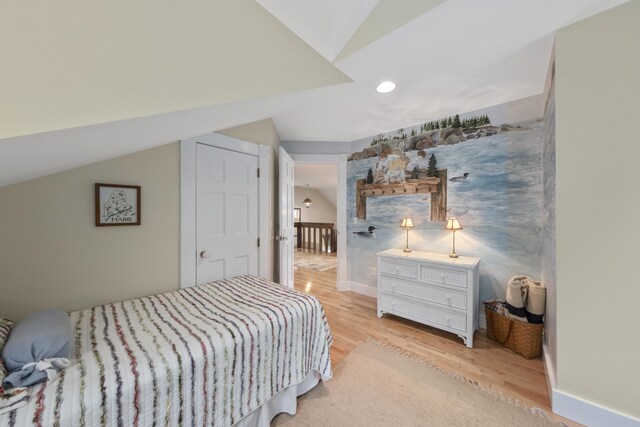 22 Porter Rd, Belfast, ME 04915 - bedroom with light wood finished floors, vaulted ceiling, baseboards, and recessed lighting