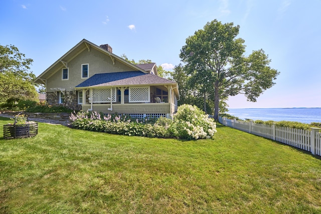 22 Porter Rd, Belfast, ME 04915 - exterior space featuring a water view, a lawn, a chimney, and fence