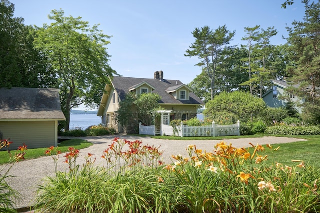 22 Porter Rd, Belfast, ME 04915 - view of front of home featuring a water view, a chimney, and fence