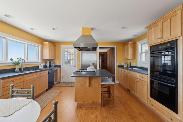 1 Moore Ln, Biddeford, ME 04005 - kitchen featuring black appliances, a sink, island exhaust hood, dark countertops, and light wood-style flooring