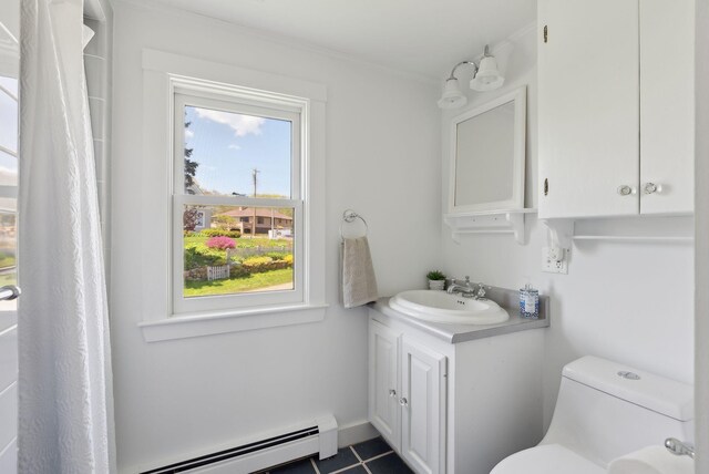 1 Moore Ln, Biddeford, ME 04005 - bathroom with vanity, toilet, baseboard heating, and tile patterned flooring