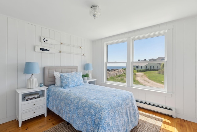 1 Moore Ln, Biddeford, ME 04005 - bedroom featuring a baseboard radiator and wood finished floors