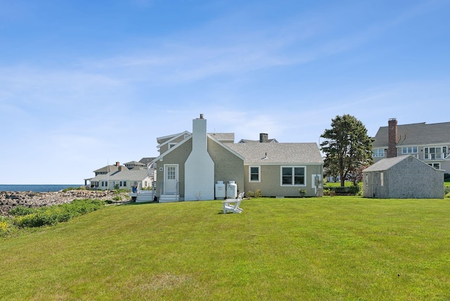 1 Moore Ln, Biddeford, ME 04005 - back of property featuring a lawn and a chimney