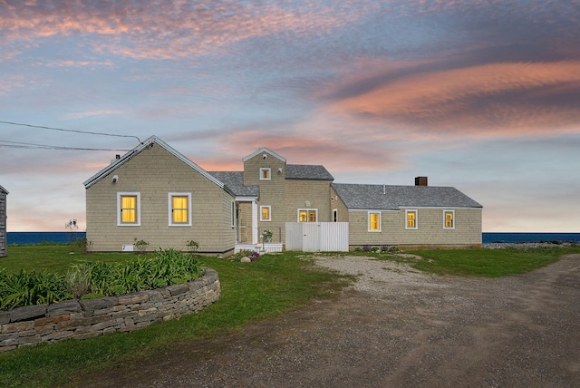 1 Moore Ln, Biddeford, ME 04005 - view of front facade featuring driveway and a chimney