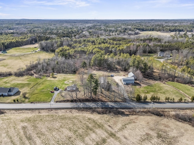 bird's eye view featuring a forest view