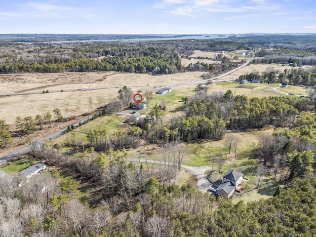 bird's eye view featuring a rural view and a wooded view