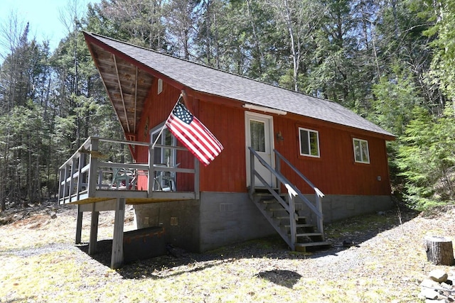 14 Mountain Stream Ln, Moscow, ME 04920 - view of front of home featuring a wooden deck, a shingled roof, and crawl space