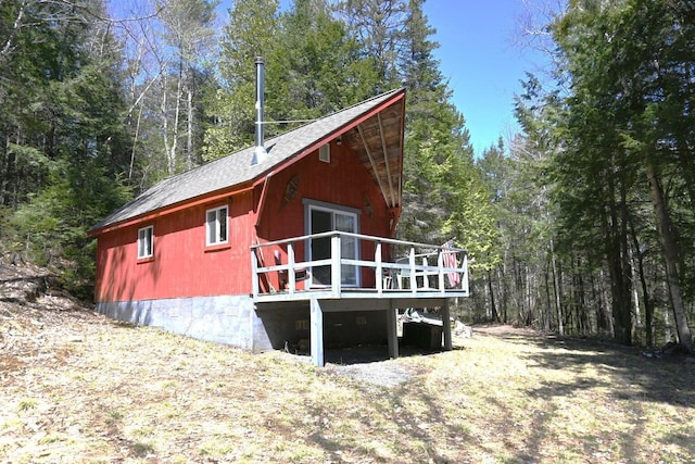 14 Mountain Stream Ln, Moscow, ME 04920 - rear view of house with roof with shingles, a deck, and a view of trees