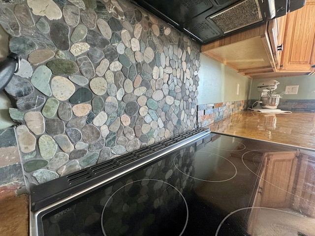 476 N Rd, Medford, ME 04463 - room details featuring range, black electric stovetop, and extractor fan