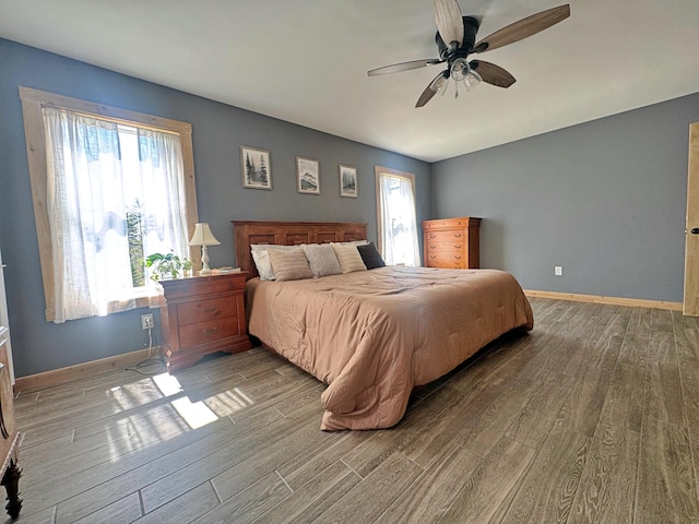 476 N Rd, Medford, ME 04463 - bedroom with baseboards, a ceiling fan, and wood finished floors