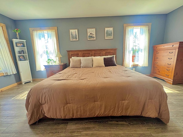 476 N Rd, Medford, ME 04463 - bedroom featuring baseboards and wood finished floors