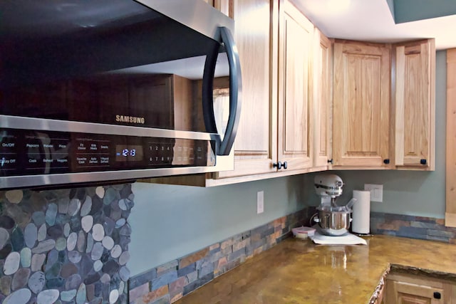476 N Rd, Medford, ME 04463 - interior details featuring stainless steel microwave and light brown cabinets