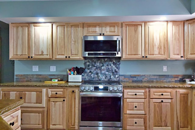 476 N Rd, Medford, ME 04463 - kitchen with dark stone counters, light brown cabinets, and stainless steel appliances