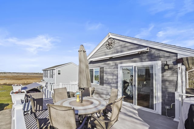wooden deck with outdoor dining area