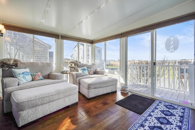 sunroom / solarium with hardwood / wood-style flooring
