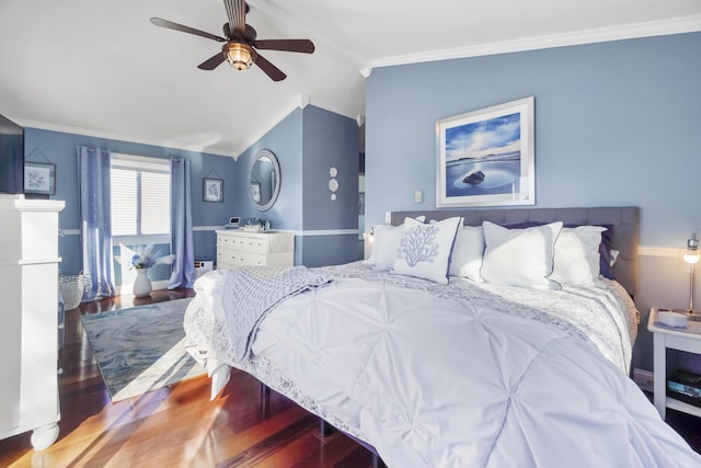 bedroom featuring lofted ceiling, wood finished floors, crown molding, and a ceiling fan