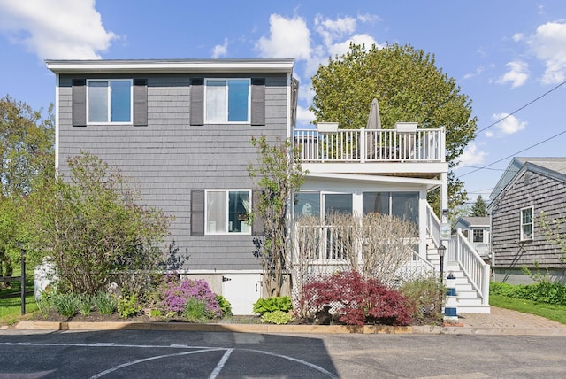17 Clifford Ln, Wells, ME 04090 - view of front of house featuring a balcony, uncovered parking, and stairs