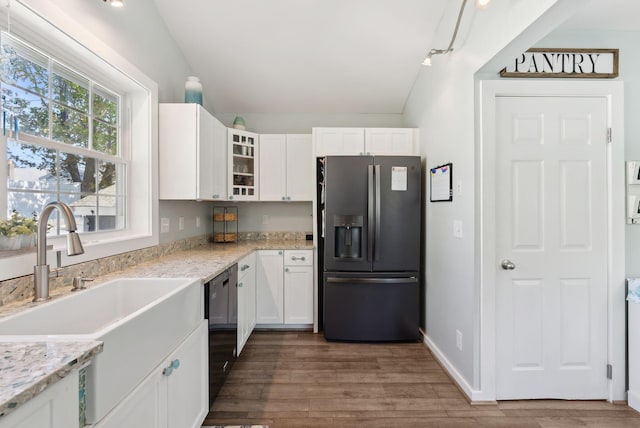 17 Clifford Ln, Wells, ME 04090 - kitchen featuring stainless steel refrigerator with ice dispenser, lofted ceiling, white cabinetry, a sink, and wood finished floors