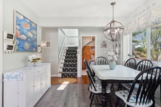 17 Clifford Ln, Wells, ME 04090 - dining space with a chandelier, stairs, and dark wood-style flooring