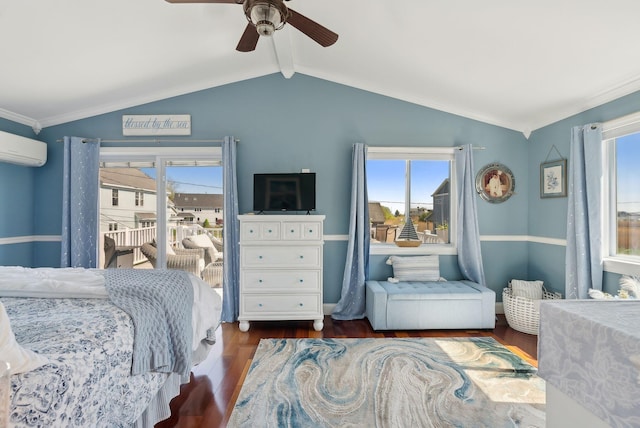 17 Clifford Ln, Wells, ME 04090 - bedroom with multiple windows, wood finished floors, an AC wall unit, and a ceiling fan