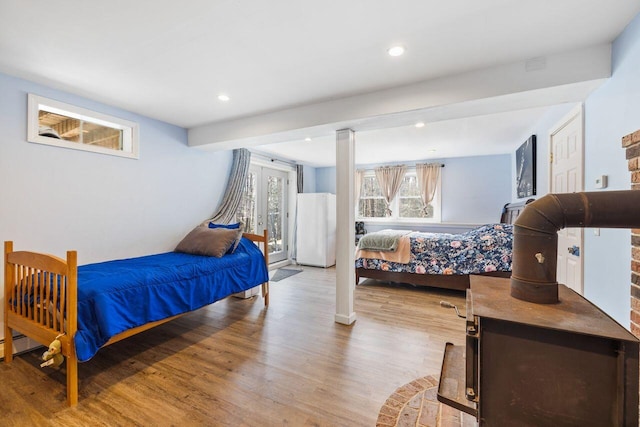 bedroom featuring light wood finished floors and recessed lighting