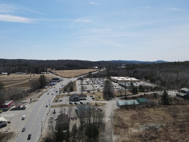 103 Fyfe Rd, Farmington, ME 04938 - drone / aerial view with a wooded view