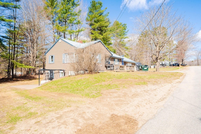 44 Sunset Ave, Wilton, ME 04294 - view of property exterior with a deck and a yard