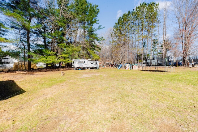 44 Sunset Ave, Wilton, ME 04294 - view of yard with a playground and a trampoline