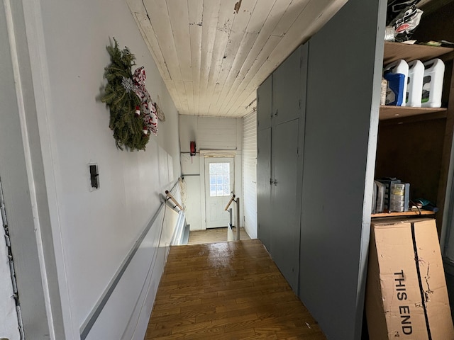 hallway with wood finished floors and wooden ceiling