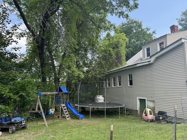 29 W Front St, Skowhegan, ME 04976 - view of green lawn with a trampoline and a playground