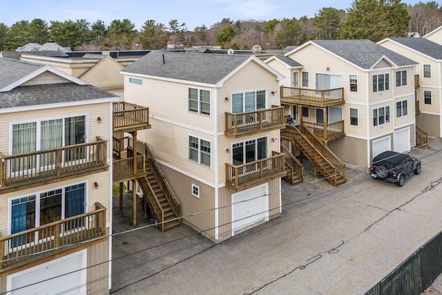 35 Barefoot Cottage Rd Unit 163, Wells, ME 04090 - view of building exterior with an attached garage and stairs