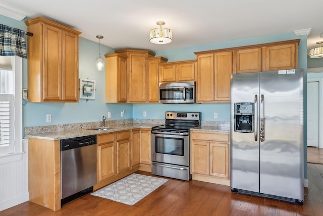 35 Barefoot Cottage Rd Unit 163, Wells, ME 04090 - kitchen featuring light stone counters, a sink, pendant lighting, stainless steel appliances, and dark wood finished floors